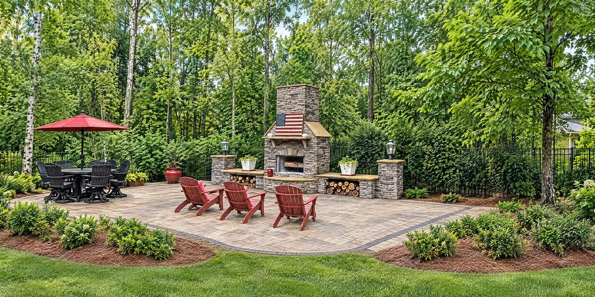 Custom stone outdoor fireplace built by Fun Outdoor Living